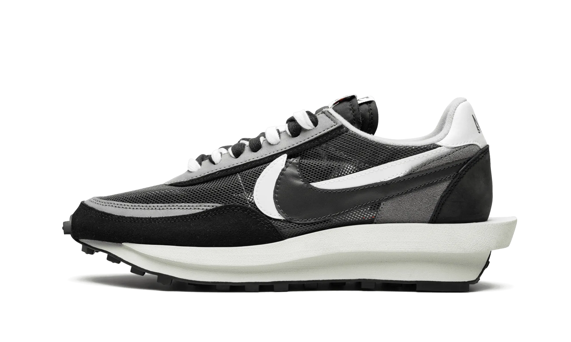 composite - sole shoes running on a dirt path LD Waffle Sacai Black Anthracite