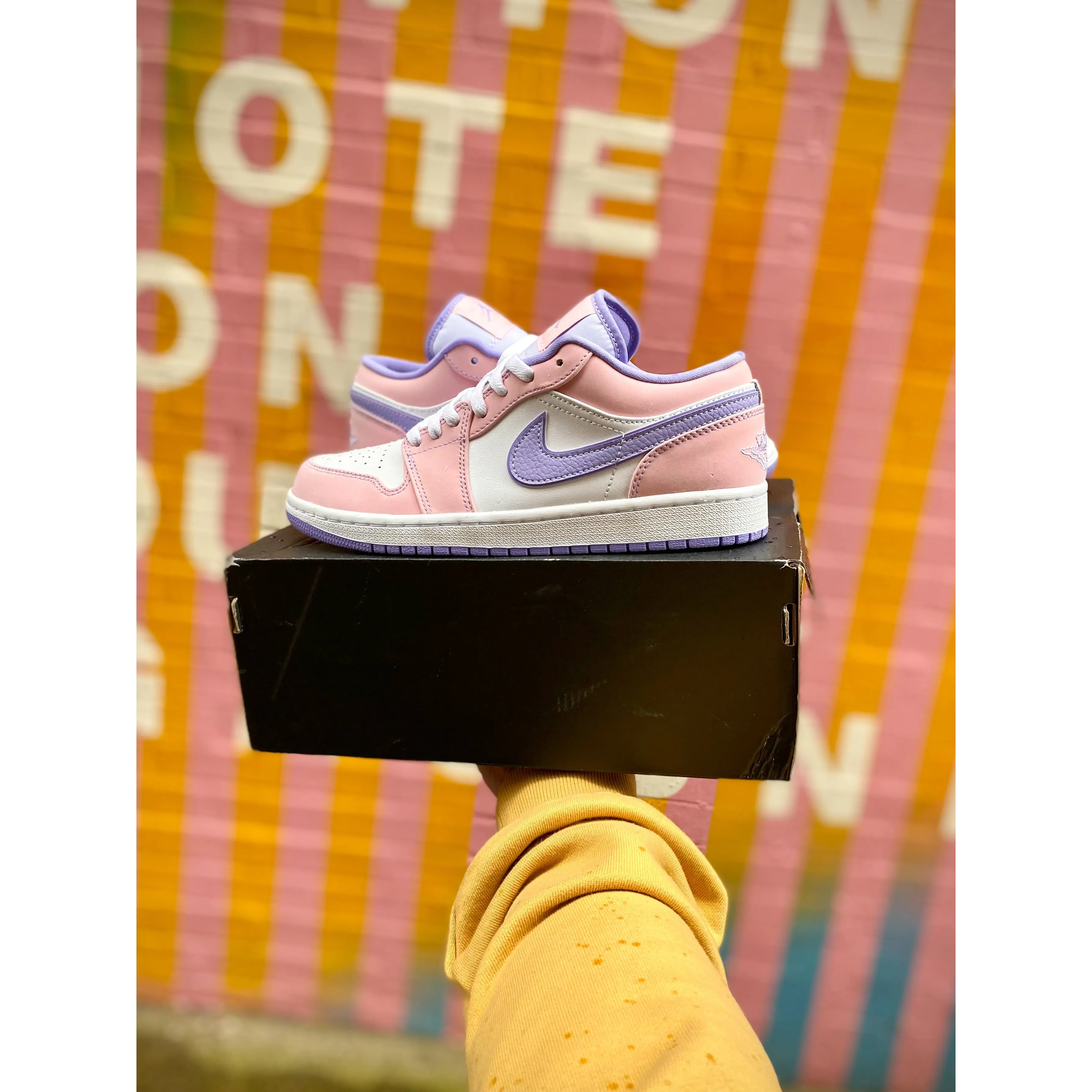 Jordan 1 Low SE Arctic Punch running on a gravel track shoes smooth - surface shoes