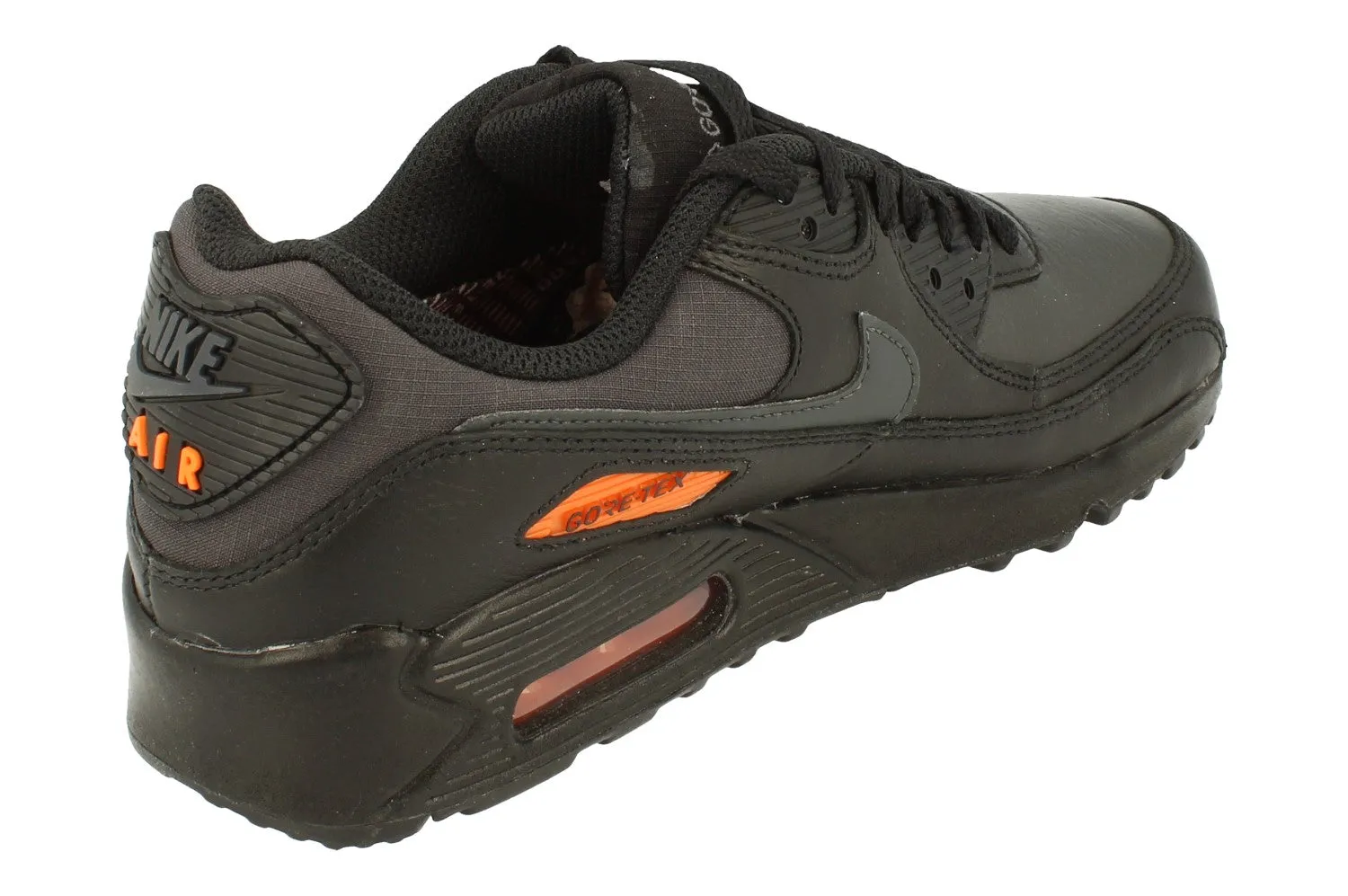 Nike Air Max 90 Gtx Mens DJ9779 002 running in a light rail station area shoes slip - on running shoes